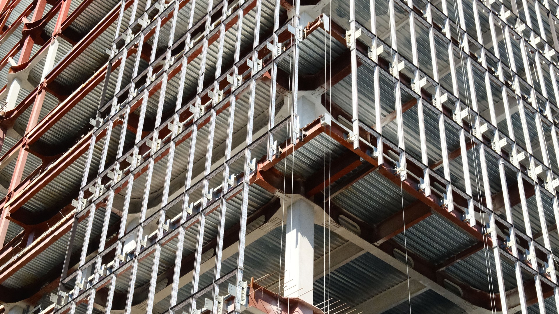 Construction site showing modern building framework with exposed steel beams